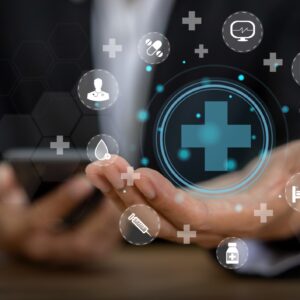 Healthcare technology icons floating above hand.